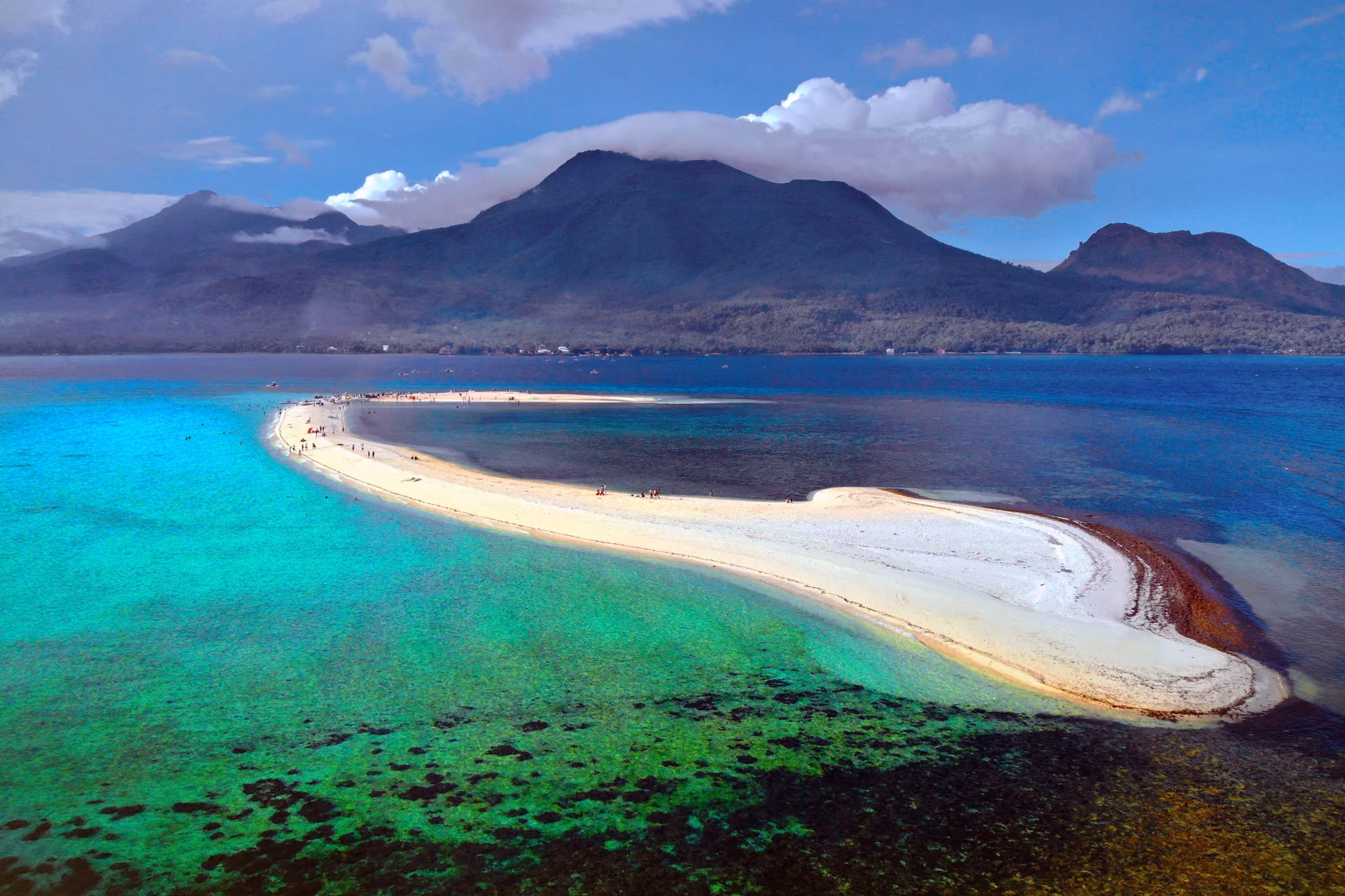 The White Island sandbar in turquoise water off Camiguin, with Mount Hibok-Hibok rising behind the island.
