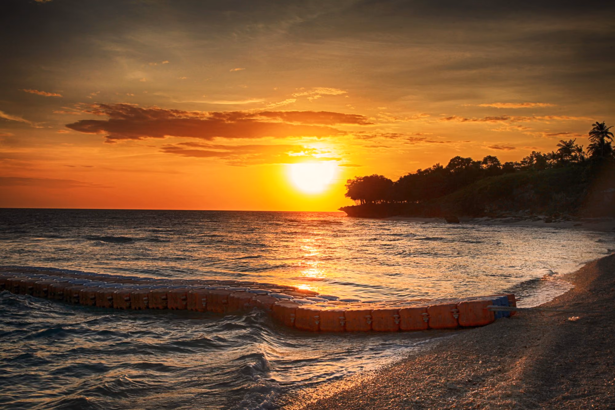 Illustrative photo of an orange sunset over the sea at Aliguay Island, off Dipolog City, Zamboanga del Norte.
